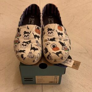 TOMS Cream Slip-Ons with Halloween Cars and Skulls Print